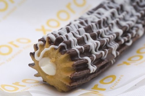 smellslikejasmine:  nataasha:   My favorite churro from Xooro, called Jordan’s Favorite. It has a nutella filling coated in milk chocolate and drizzled with white chocolate.  sounds so goooood. i wanna try. dammn that loooks sooo goood!