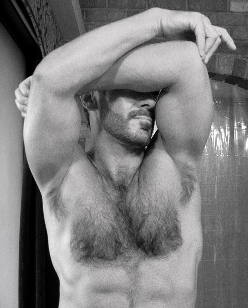 Armpits and muscles and fur and a sexy beard.  The hint of a smile.  The coyness of hiding his eyes.