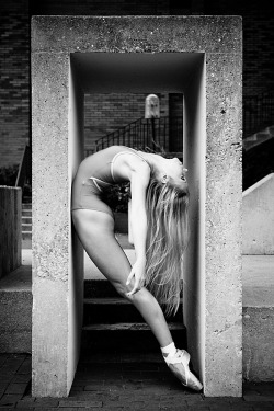 black-and-white:  dancer against concrete
