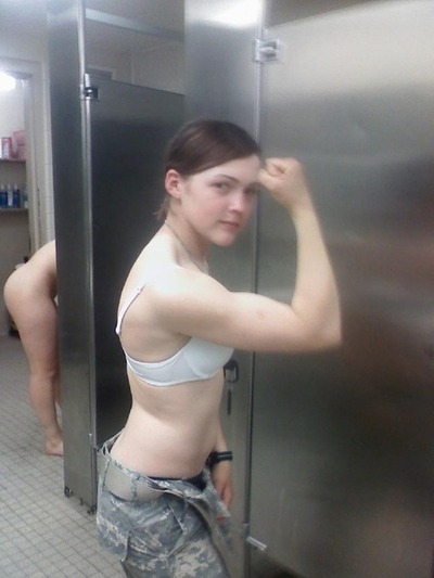 oif3rd:  U.S. Army girl showing her guns in the bathroom, nice background too!