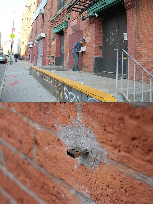 thedailywhat:  Art Project of the Day: Aram Bartholl has been going around NYC installing a number of anonymous, offline, public p2p file-sharing networks in the form of wall-embedded USB flash drives into which anyone can connect in order to upload/downl