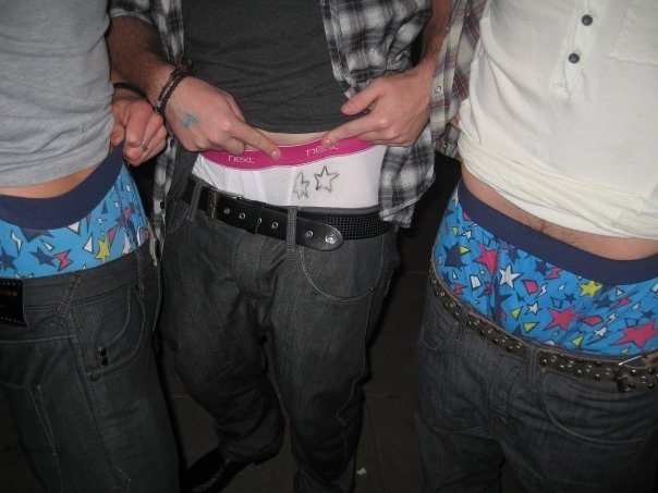 The guy in the middle is Mikeyy86naked (unfortunately not so naked).  You can tell