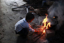 A six-year-old HIV carrier, has been living alone since his parents died of AIDS. The boy, known as Ah Long, does his own washing, cooking, studying and he also rears some chicken. He lives in his parents’ house at the foothill village of Malu Mountain