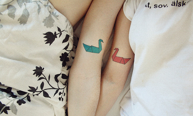 Couple matching heart and key tattoo