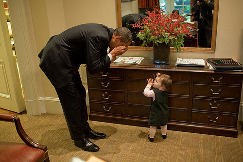 -lovelyaffair:   President Barack Obama plays peek-a-boo with Maeve Beliveau, the