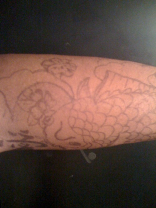 ayeitsmarkanthony:  So today in school i was boared in my study hall class so i decided to go to my old Art & Music Teacher , Mr. Lam. i was talking to him about how i wanted a tattoo , and this is what he came up with . isn’t he a legit teacher