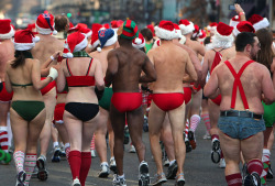 During the annual Santa Speedo Run, which started at the Lir Irish Pub &amp; Restaurant, these runners take up the rear of the race on December 11th, 2010 in Boston, Massachusetts. (John Tlumacki/Boston Globe)