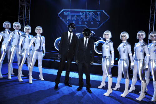 Daft Punk At The Premiere Of Tron: Legacy, Wearing Balenciaga, Robot Helmets And Gloves. Surrounded By