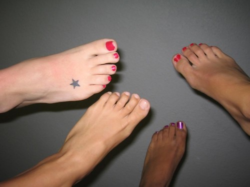 One pair of nice feet is great, but four… OMG, I would like to see something like this in rea