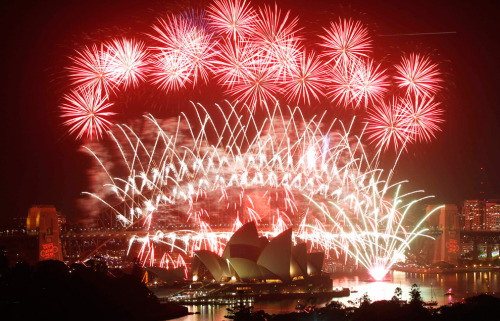 Fireworks explode over the Sydney Harbour Bridge and Opera House during a pyrotechnic show to celebr