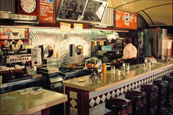 Miss Albany Diner oil on linen by Ralph Goings,