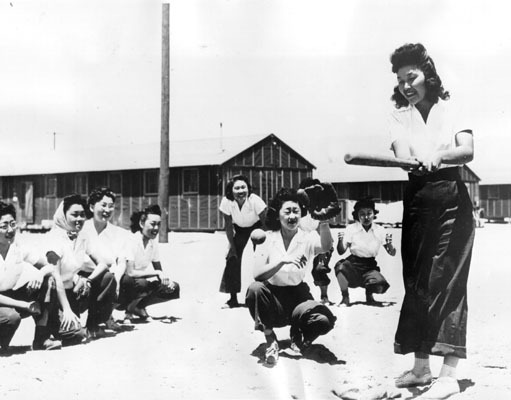 fuckyeahapihistory:
“ Girls’ baseball team at Manzanar. July 17, 1942
Japanese-American prisoners made Manzanar more livable through recreation. They participated in sports, including baseball, football, and martial arts. Maye Noma, behind the plate,...