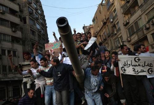 Egyptian Protesters Stand Atop An American Made M60.