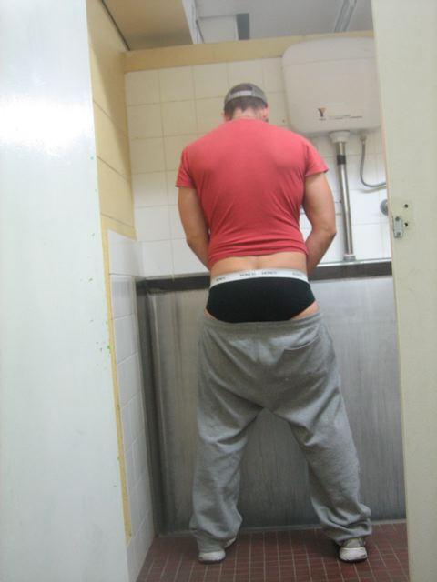 Straight bro, pissin at a urinal with his sweats down showing his ass in black briefs. 