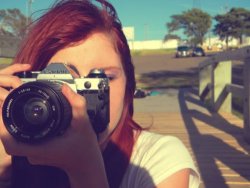 karlathegeek:  kimmiewimmie:  GIVEAWAY. Okay, so. I’m giving away this camera. Its a Canon AE-1. Its a film camera. Comes with the body and the lens that you see in the picture. (Yes, thats me in the picture. PROOF that I actually own it.) Another zoom