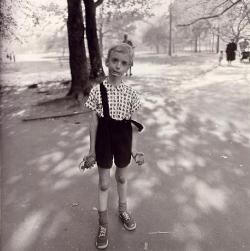 gurry-blog:  Child with Toy Hand Grenade in Central Park, New York City, USA (1962) is a famous photograph by Diane Arbus. The photo shows a boy, with the left strap of his jumper awkwardly hanging off his shoulder, tensely holding his long, thin arms
