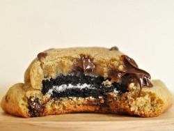 latenighttyler:  johnkevinratcliffe:  Got cookie dough, put an Oreo in the middle, bake for 15-20 minutes. Bomb af&lt;3  BOMBASFUCK SERIOUSLY.  omg I made these and I kind of died Both for the fact that they were so delicious and because they KILLED my