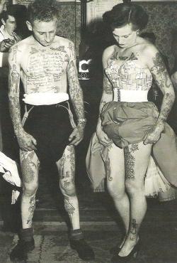 rockabillyhitsandhousewifeshit:  dreaminparis:  A man and woman showing off the work of legendary tattoo artist Les Skuse.   forever my favourite photo 