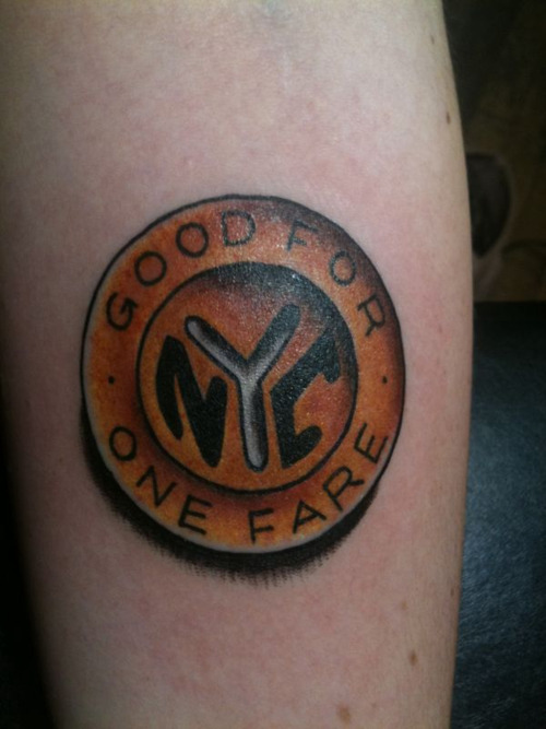 old school nyc subway token on my forearm. my fourth and favorite tattoo so far.