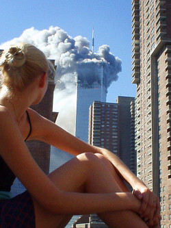 alexisbelon:  Australian model caught distracted during a photo shoot when the first plane hit tower 1. What an epic photo. 