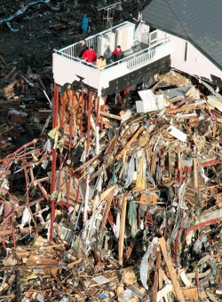 honeyshack:  rodrigoebr:  People wait for rescue on the rooftop of a ruined building tangled with tsunami-drifted debris in Rikuzentakada, Iwate Prefecture. (Kyodo photo)  But then there is this. Perspective. 