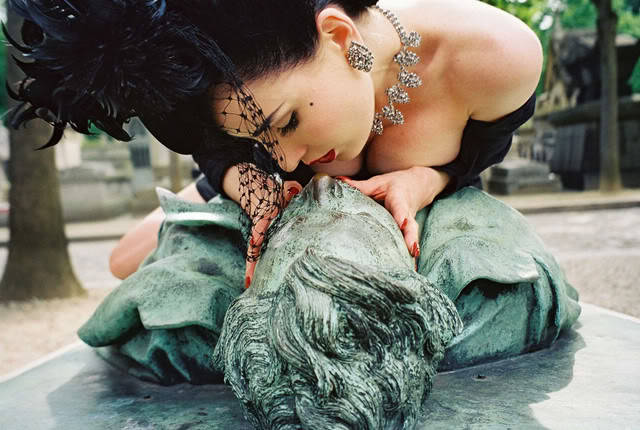  Dita von Teese posed on top of Victor Noir’s grave statue in Paris, 2003 There