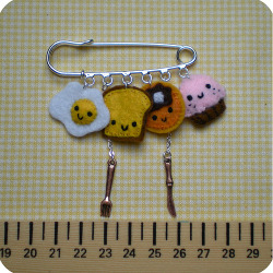 daintyloops:  This is so freaking cute that my brain wants to explode… Breakfast Felt Safety Pin (by Memi The Rainbow) 