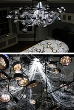 peetypassion:  The bacteria-based light is an experiential take on traditional  chandeliers. Attached to the fixture are many Petri dishes that house  actual DNA swabbed from the homeowners and visitors to create a network  of living, breathing bacteria