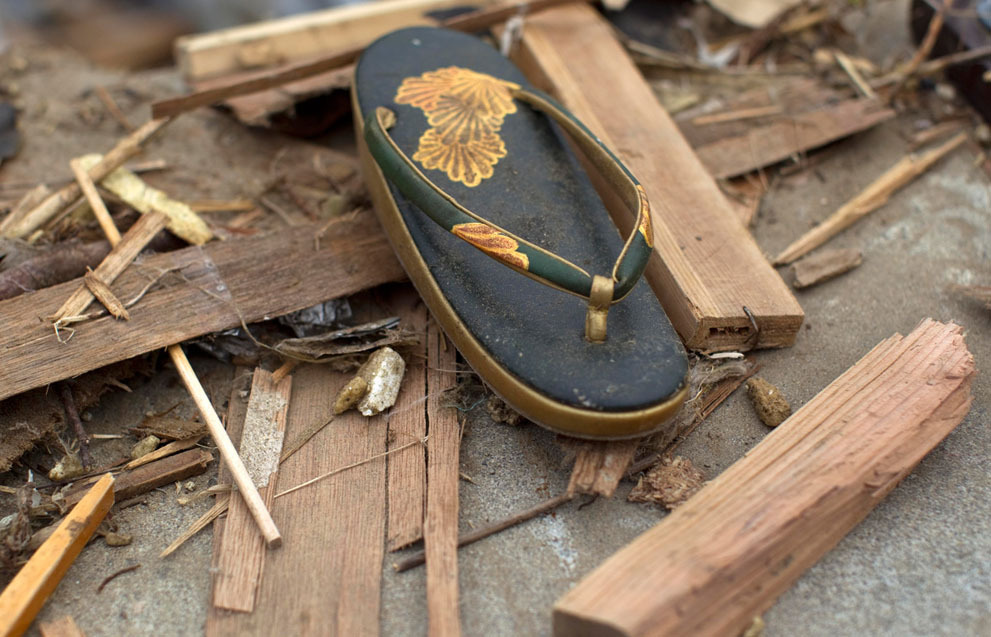 tataraseitetsu:
“ raurublock:
“ Japan Earthquake: Two Weeks Later - Alan Taylor - In Focus - The Atlantic
A traditional Japanese sandal, worn with formal kimono dress, lies in the rubble in the earthquake and tsunami destroyed town of Onagawa, Miyagi...