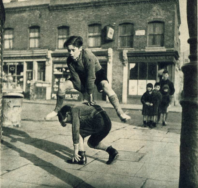 Haywood Magee
A group of children playing leap frog in the street. 1950
Thanks to contrive