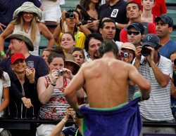 wecanbeserious:  inothernews:  FULL FRONTALCOURT   Fans watch and take photos of Rafael Nadal of Spain as he towels off  after defeating compatriot Feliciano Lopez at the Sony Ericsson Open  tennis tournament in Key Biscayne, Florida.  (Photo: Reuters