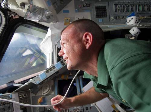 #STS132 - note the fluffy/fuzzy dice behind Tony Antonelli :)