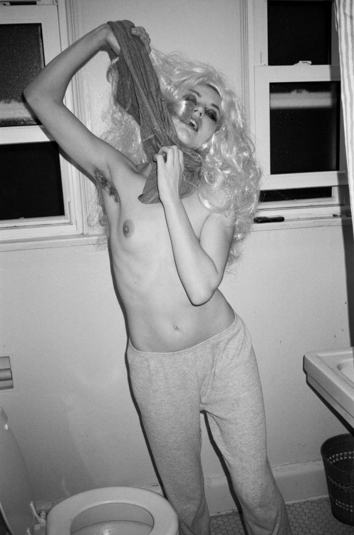 bradelterman:  Model Nettie Harris doing a quick change during our photo shoot this week. She is so full of life and so promising. Shot with black and white film and a Contax T3.  Photo by Brad Elterman
