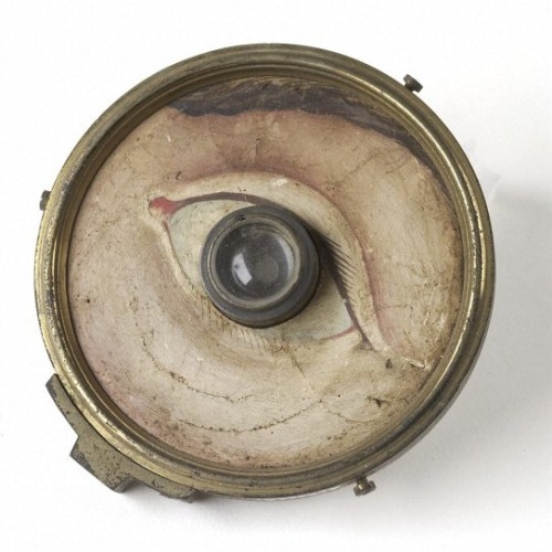 unnaturalist: Model eye, glass lens with brass-backed paper front with hand-painted face around eye,
