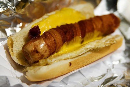 fuckyeahawesomefood:  A “Good Morning” from Crif Dogs, NYC a bacon wrapped dog smothered with melted cheese and a fried egg.