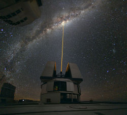 lickystickypickyme:  Real life Star Wars.Laser Towards Milky Ways Center.The color of the laser is precisely tuned to energize a layer of  sodium atoms found in one of the upper layers of the atmosphere — one  can recognize the familiar color of sodium
