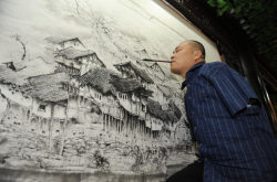 tristanmichael:  A man with no arms has become the vice curator of Chongqing Talents Museum in China, which display some of his own work completed using his feet and mouth. 41-year-old Huang Guofu lost both of his arms when he was four years old after