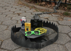 fortheloveoflindsey:  Hipster trap in NYC. Including (but not limited to) Green Ray-Ban wannabes, gold bike chains, PBR, American Spirit cigarettes, and a Holga camera. bahahahahah. Priceless. 