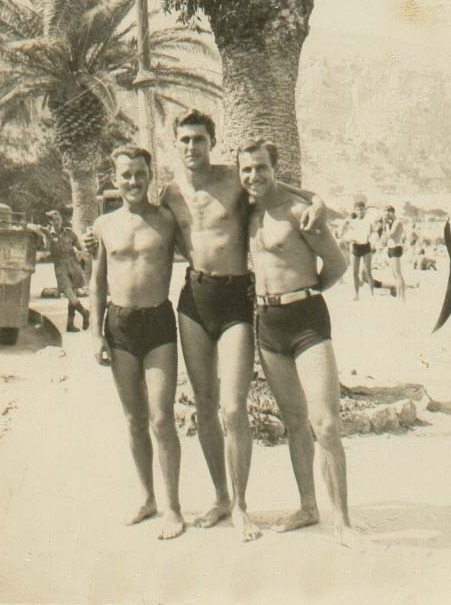 Gorgeous tall guy with two friends