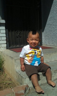 Charles-D-M:  My Nephew Sporting His Mohawk Haha Only Asian Babys Walk Around Barefooted.