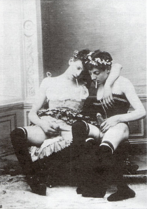 A vintage photograph of two gay men in drag.