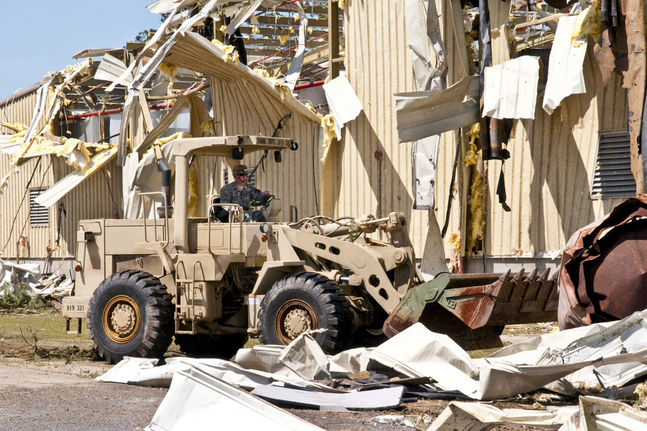 A U.S. Army soldier moves debris with a bulldozer on Fort Bragg, N.C., April 18, 2011, as part of the effort to clean up areas hit by a tornado, which struck Fayetteville and the southern edge of Fort Bragg, April 16. The soldier is assigned to the...