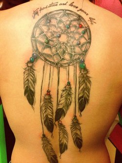 fuckyeahtattoos:  the dreamcatcher is my tattoo. it represents what a dreamcatcher is meant to do. watch over and catch the evil. it symbolizes all the times shits happen but overcome it and now im the person i am today, loving life. i got it on my back