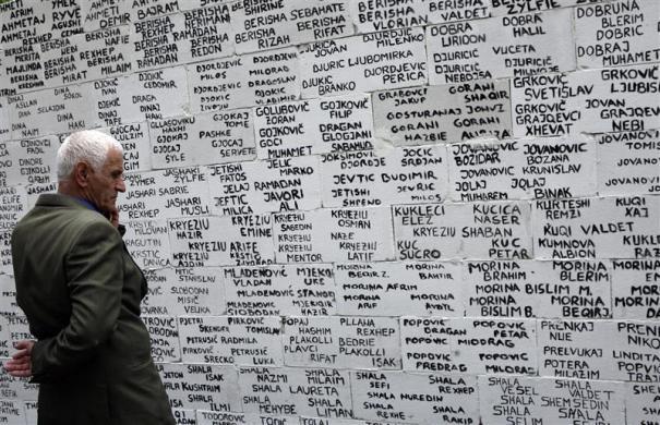 getpoliticized:  28 April 2011 A Kosovo Albanian man looks at the names of missing