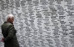 getpoliticized:  28 April 2011 A Kosovo Albanian man looks at the names of missing people, both Albanians and Serbs, written on a wall by a Human rights NGO in Pristina. Reuters 