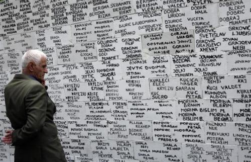 getpoliticized:  28 April 2011 A Kosovo Albanian man looks at the names of missing people, both Albanians and Serbs, written on a wall by a Human rights NGO in Pristina. Reuters 