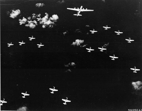 313th Bomb Wing B-29 escorting unidentified 7th Fighter Command P-51 mustangs from Iwo Jima to Japan