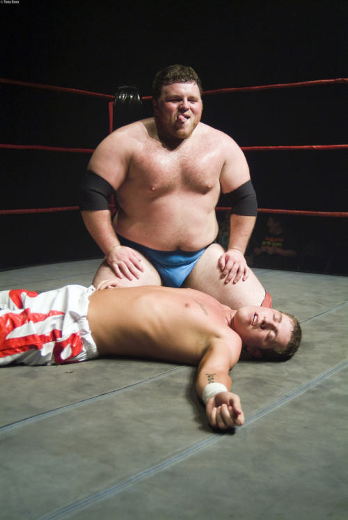 bearmythology:  Lucky kid faking unconsciousness as the beastly Dave Mastiff prepares to dine on him. Gawrsh. This is why I wanna be a pro-wrestler!