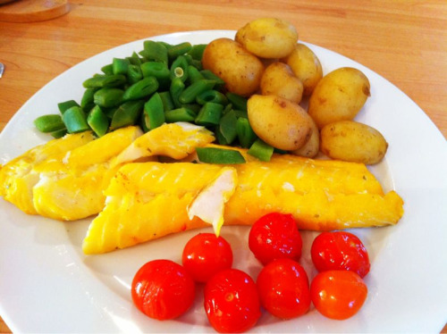 Double rainbow dinner! (Cod loin roasted in a bag with white wine, garlic butter, and cherry tomatoes; with steamed runner beans and new potatoes.)