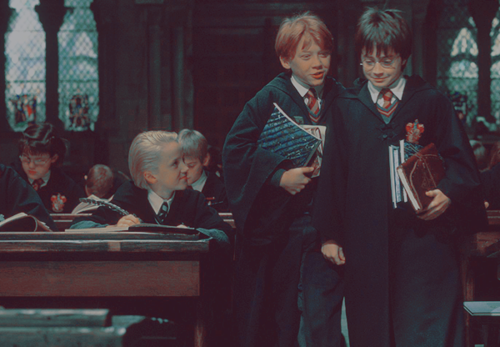 quafflepuncher:  Draco’s looking at Harry, Harry’s trying mad not to blush and